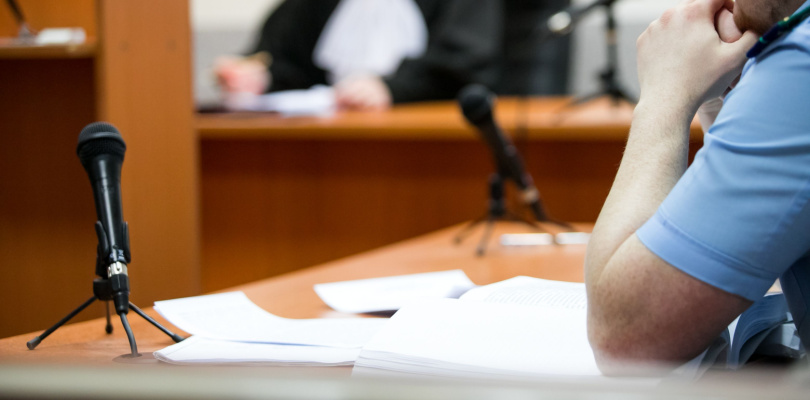 Lawyers listening to the judge in the court room